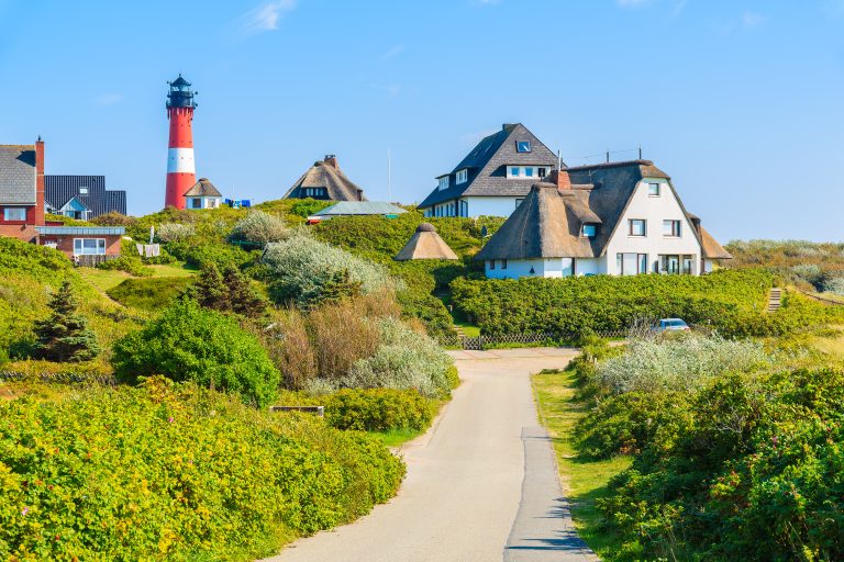 Road to lighthouse in Hornum village on southern coast of Sylt island, Germany