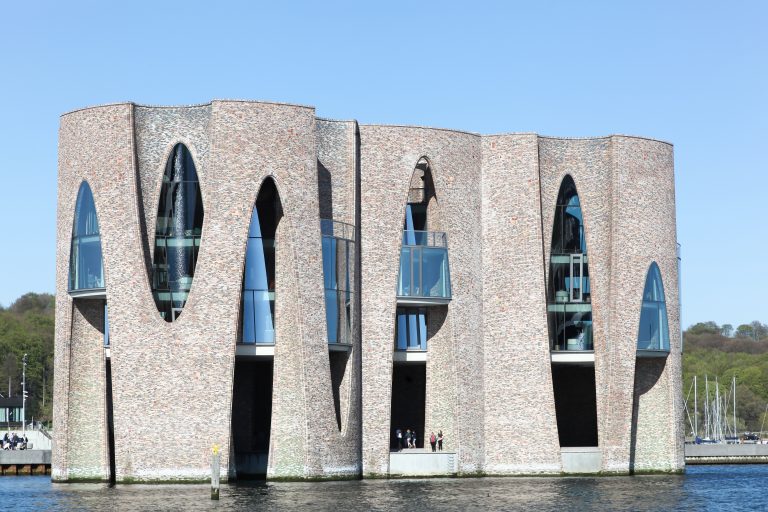 Vejle, Denmark - April 21, 2019: Fjordenhus is Vejle's new iconic building by the citys waterfront. World-renowned Danish-Icelandic artist Olafur Eliasson has created the building