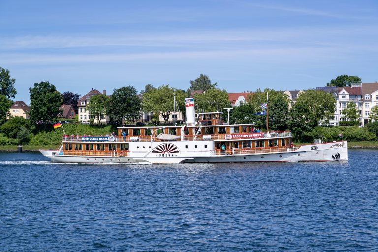 KIEL, GERMANY - JUNE 5, 2022: side-paddle steamer FREYA in the Kiel Canal